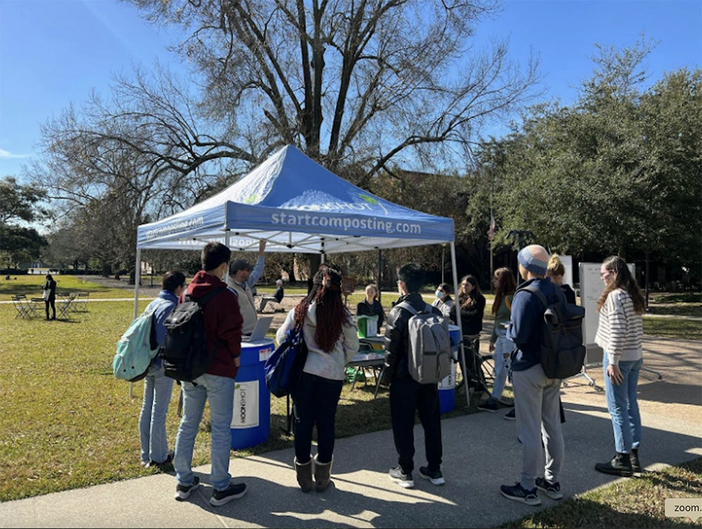 composting tent with lots of people
