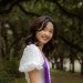 woman with purple sash